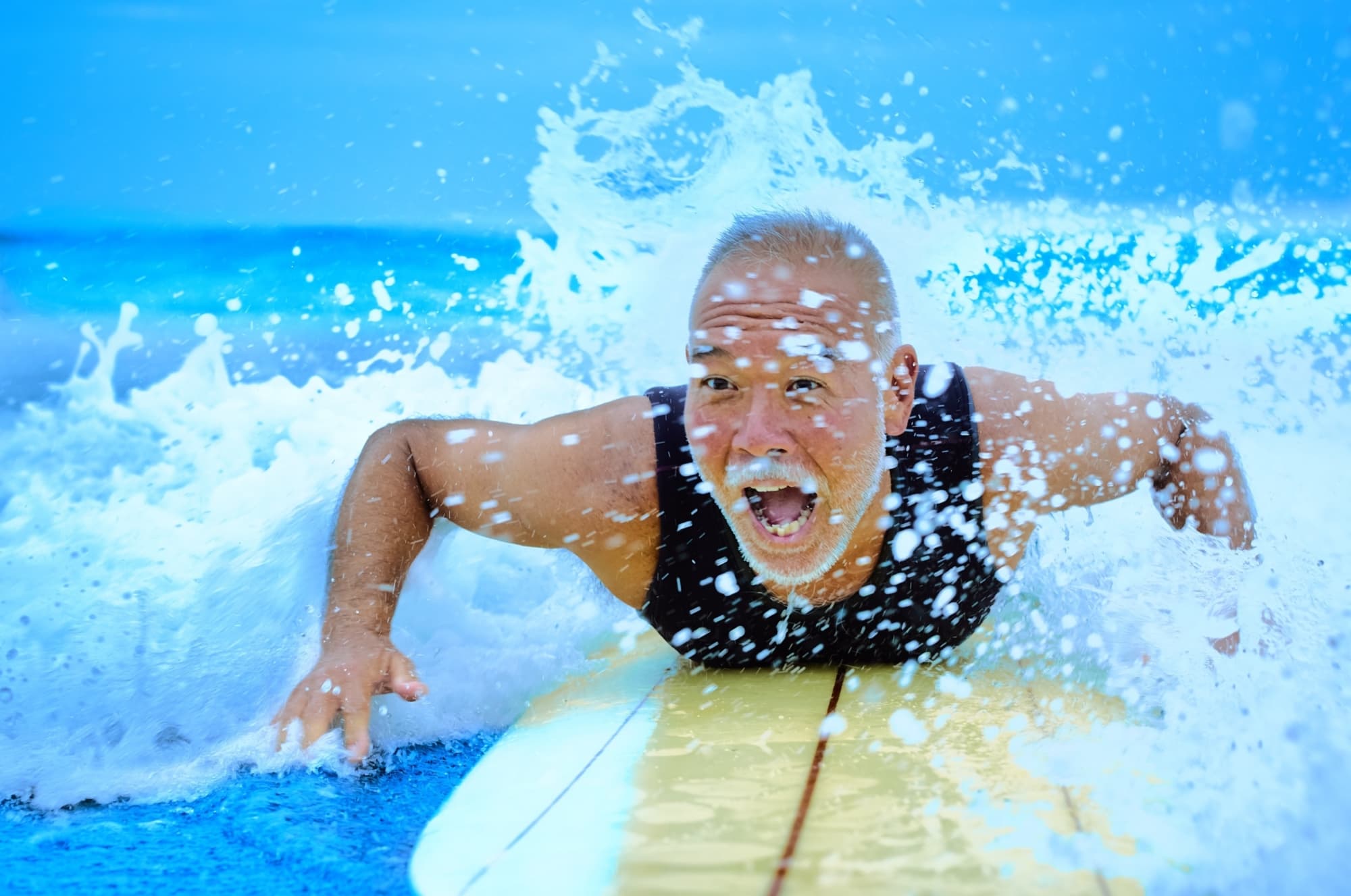 Getty Images 980387184 Surfer paddling surfboard